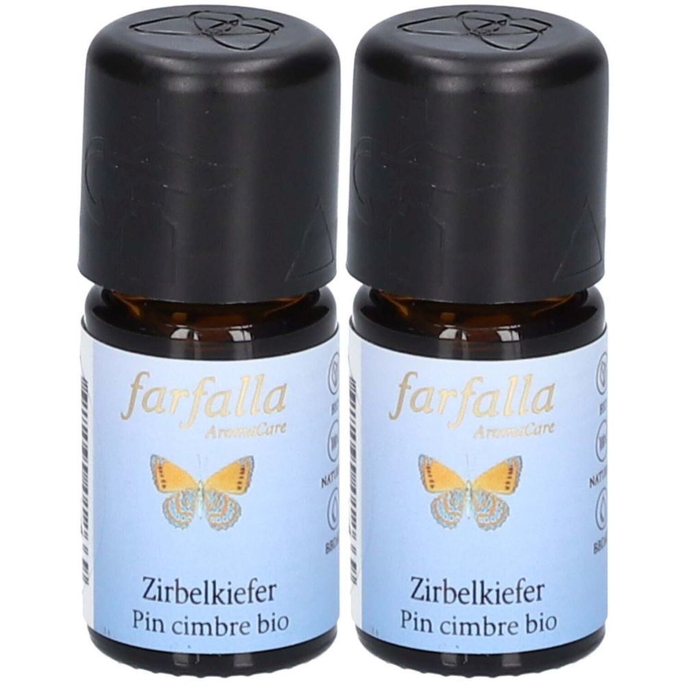 Deux petites bouteilles en verre brun avec des bouchons noirs. Les étiquettes indiquent "farfalla" et "Zirbelkiefer".