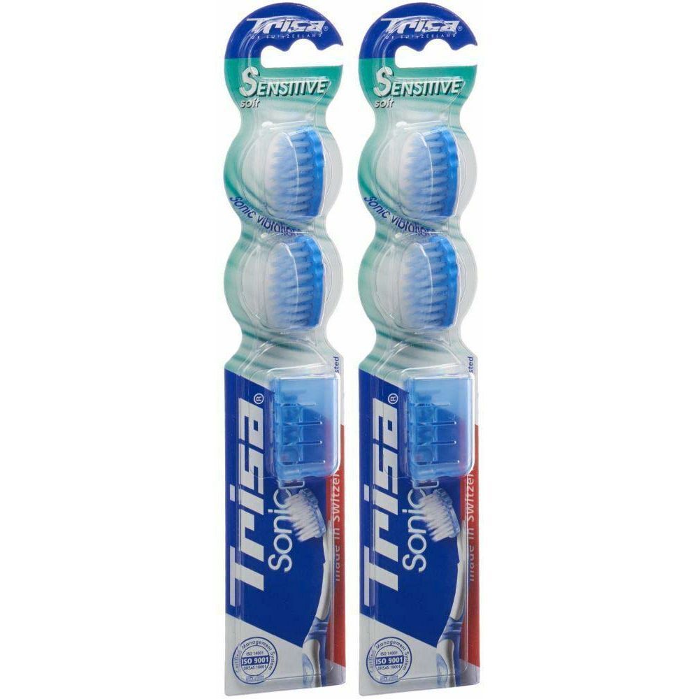 Deux brosses à dents dans un emballage. Soies bleues et blanches. Marque : Trisa Sonic. Inscription : Sensitive.