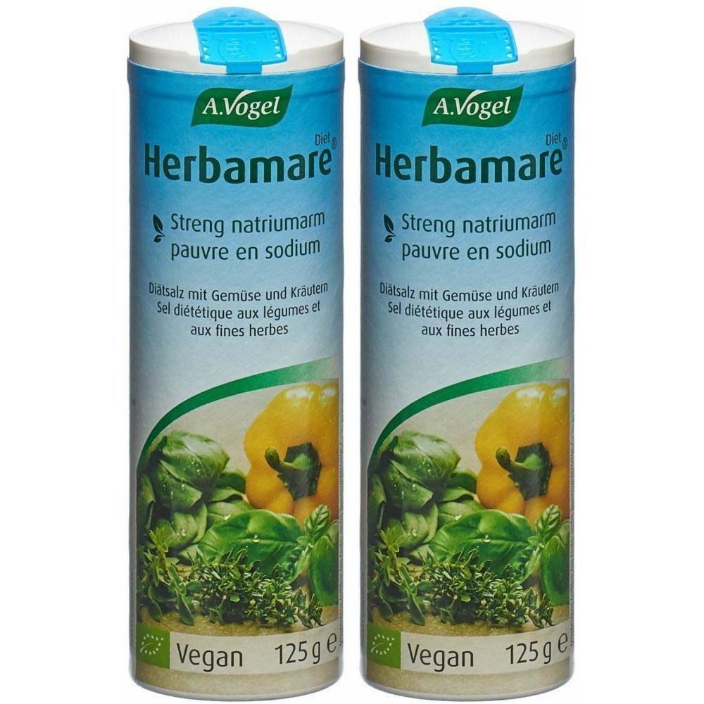 Deux boîtes cylindriques de sel Herbamare. Étiquettes bleues avec nom du produit, illustrations de légumes et logo Vegan.