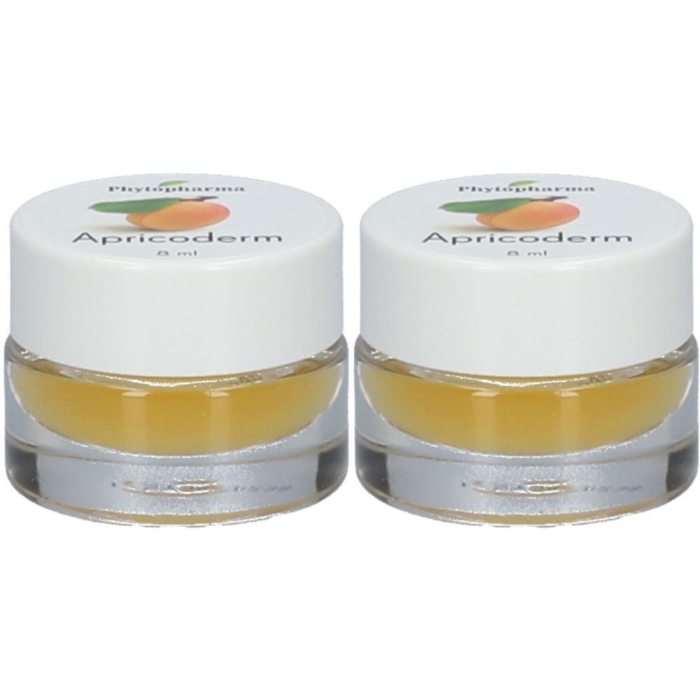 Deux petits pots ronds avec couvercles blancs. Sur le couvercle, "Phytopharma Apricoderm". Le contenu est jaunâtre.