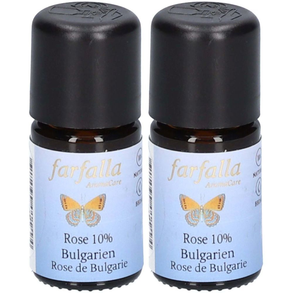 Deux petites bouteilles en verre avec bouchons noirs. Étiquettes : "farfalla", "Rose 10% Bulgarien", papillon.