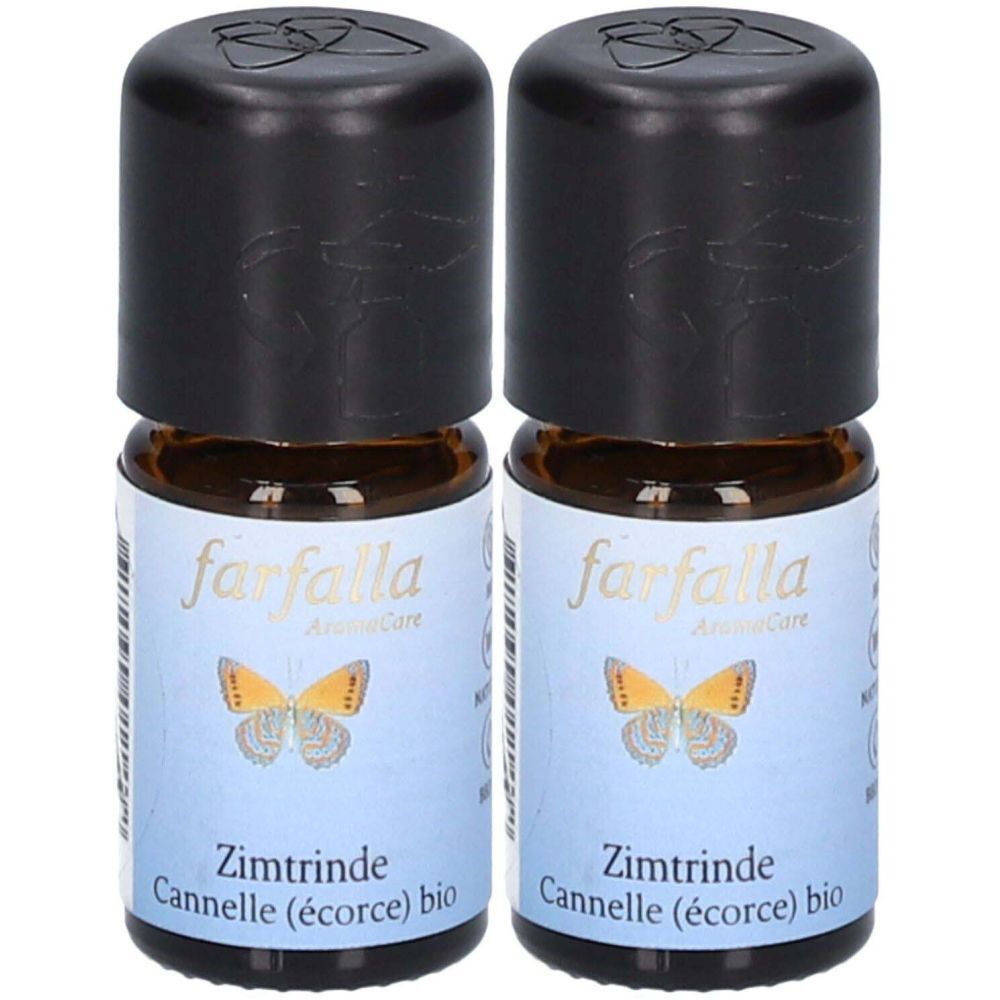 Deux petites bouteilles en verre brun avec bouchons noirs. Étiquettes avec "farfalla" et "Zimtrinde".