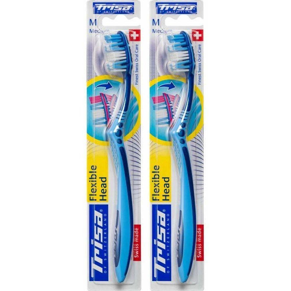 Deux brosses à dents bleues emballées. Inscription : Trisa, Flexible Head, Swiss made. Medium.