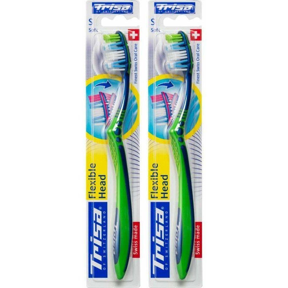 Deux brosses à dents emballées. Manches verts, soies bleues et vertes. Inscription: Trisa, Flexible Head, Swiss made.