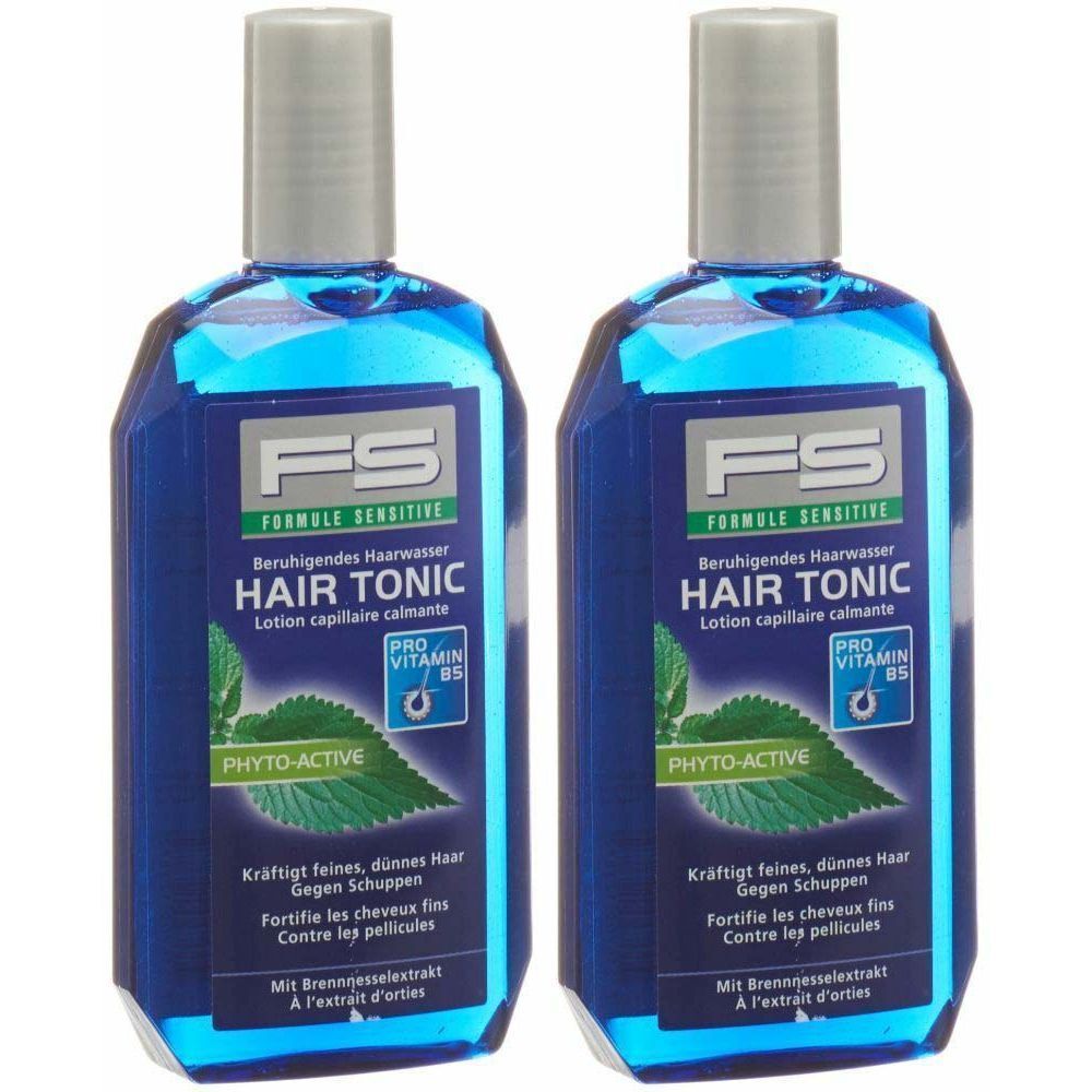Deux flacons bleus avec bouchon gris. Inscription: FS HAIR TONIC. Contient de l'extrait d'ortie.