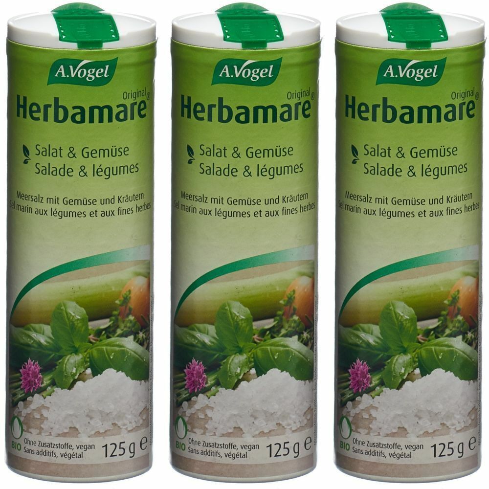 Trois boîtes cylindriques de sel aux herbes Herbamare A. Vogel. Emballage vert et blanc avec nom du produit et légumes. 125g.