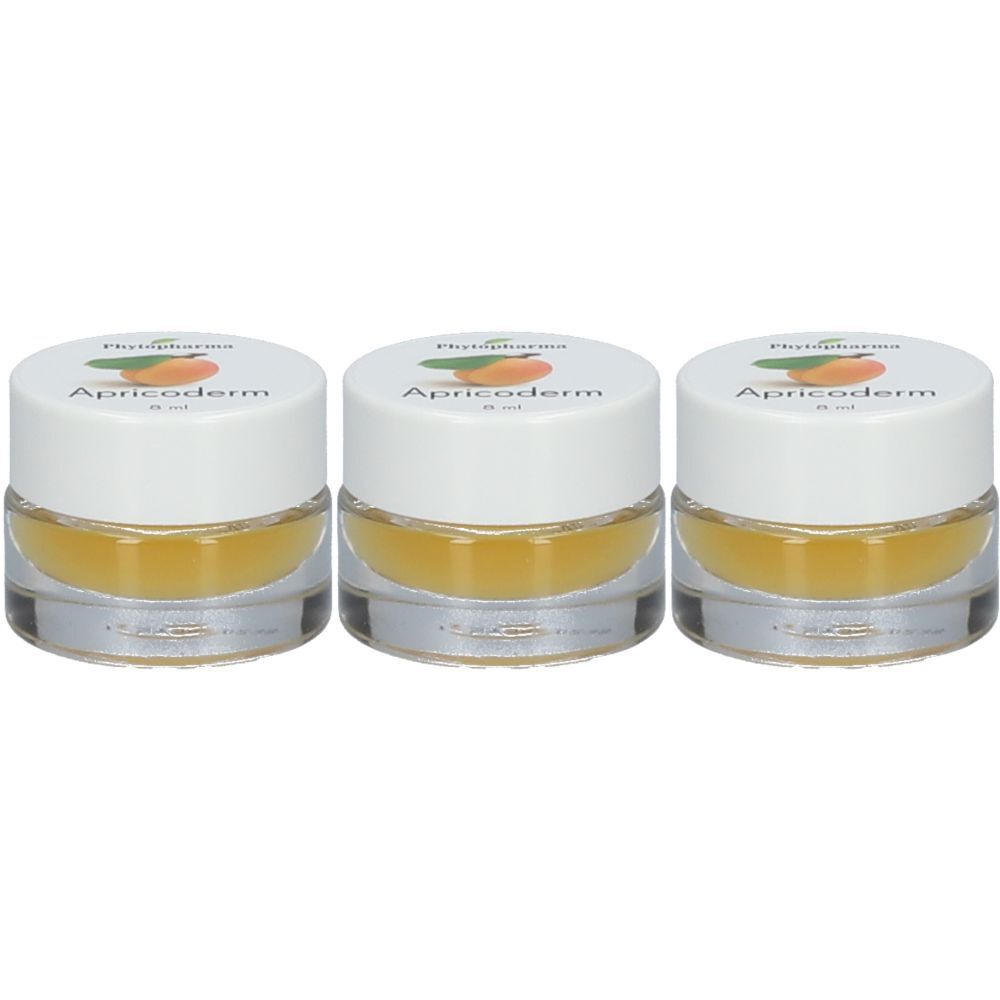Trois petits pots transparents avec couvercles blancs. Sur le couvercle, on lit "Phytopharma Apricoderm". Le contenu est jaunâtre.
