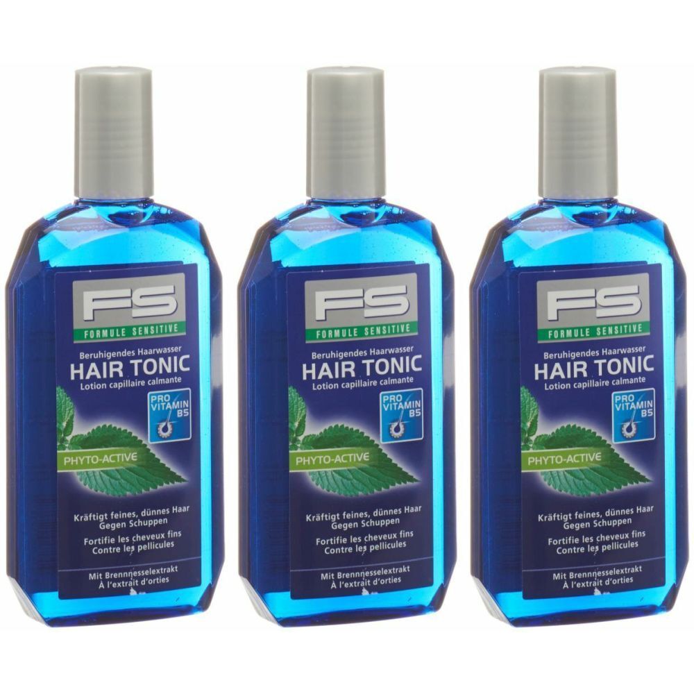 Trois flacons de Hair Tonic. Liquide bleu dans des flacons bleus angulaires avec des bouchons argentés. Inscription : FS, Hair Tonic, Phyto-Active.