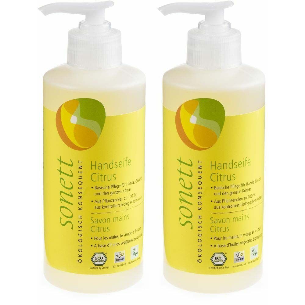 Deux flacons de savon liquide avec pompe. Étiquette jaune avec texte et logo. Inscription : Handseife Citrus, sonett.