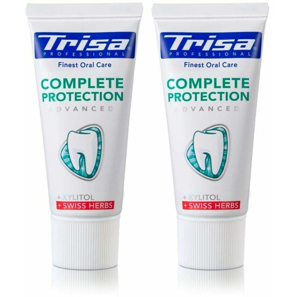 Deux tubes de dentifrice. Blancs, avec texte bleu et vert. Inscription: Trisa, Complete Protection, Swiss Herbs.