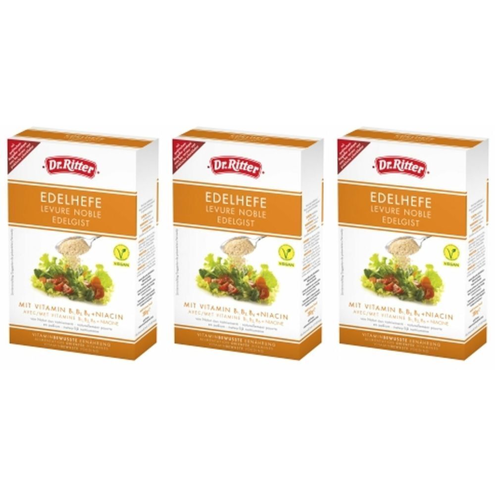 Trois boîtes de Dr. Ritter Edelhefe. Inscriptions : nom du produit, logo, illustration de légumes et de champignons, et informations sur les vitamines.