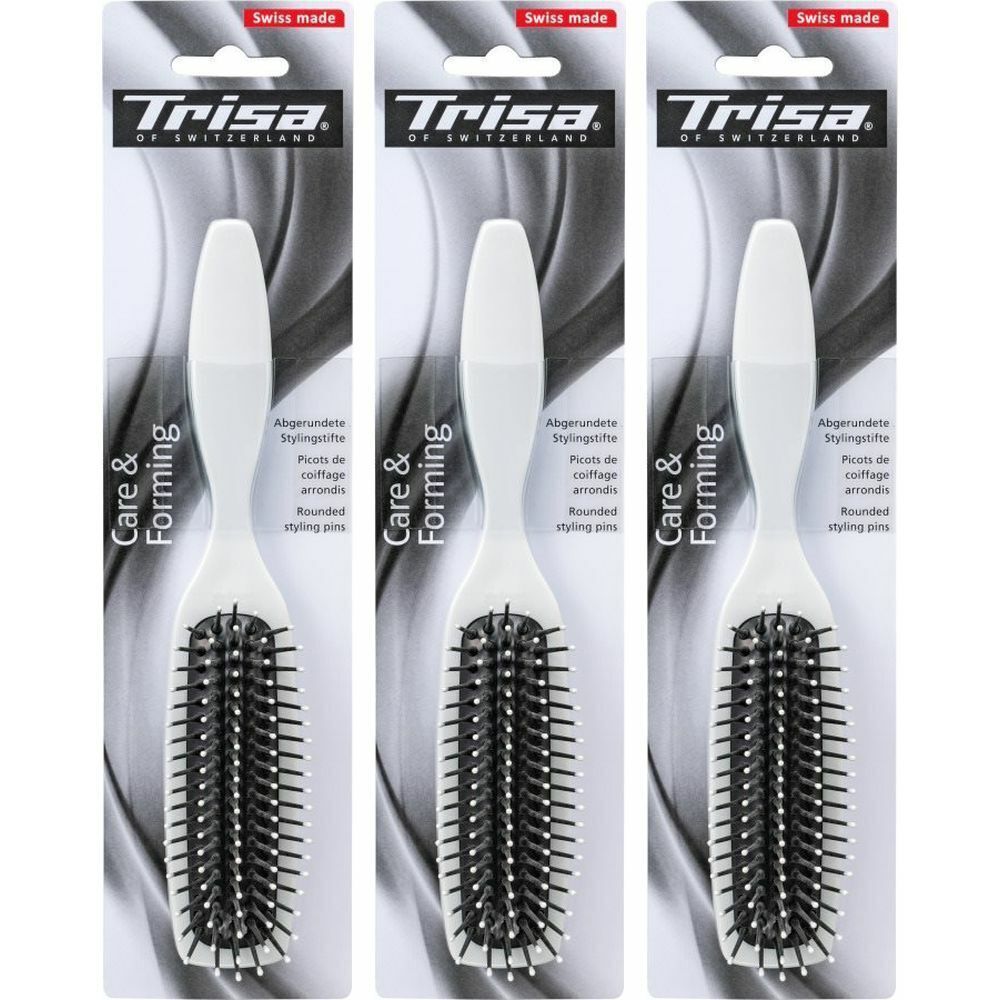 Trois brosses à cheveux blanches avec des poils noirs. L'emballage porte les mentions "Trisa" et "Swiss made".