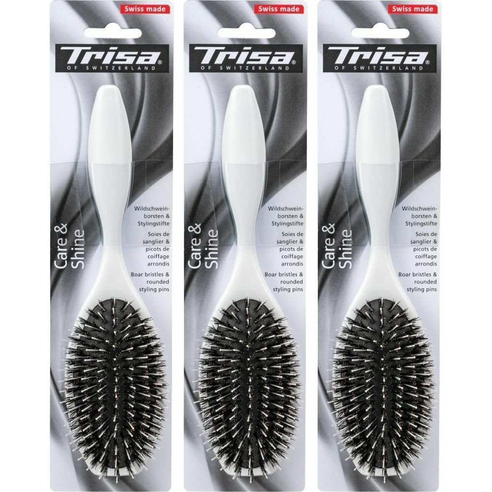 Trois brosses à cheveux emballées. Manche blanc, soies noires. Inscription : Trisa, Care & Shine, Swiss made.