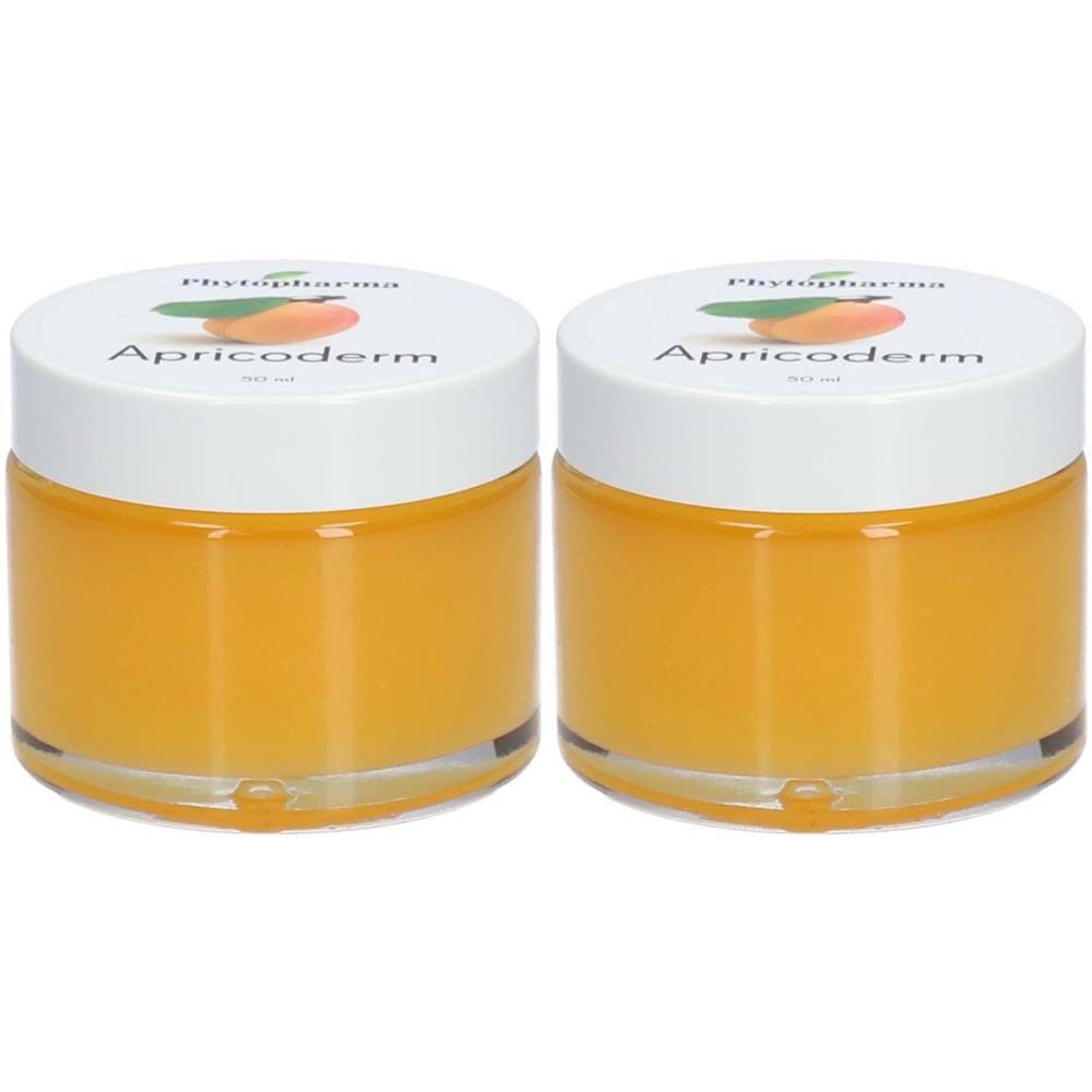 Deux pots avec couvercles blancs. Le couvercle porte "Apricoderm" et un logo. Le contenu est orange.