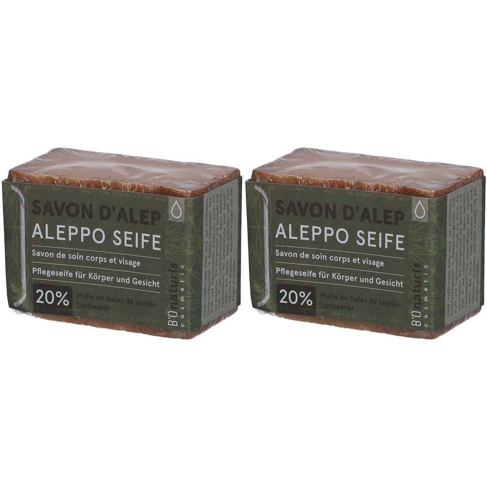 Deux blocs de savon rectangulaires emballés. Inscription: SAVON D'ALEP ALEPPO SEIFE, 20%.