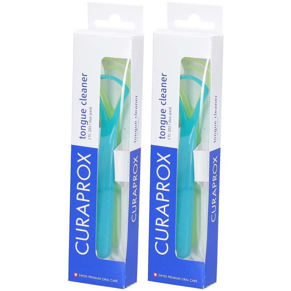 Deux grattoirs à langue dans leur emballage. Manches bleus, grattoirs verts. Emballage avec logo CURAPROX et nom du produit.