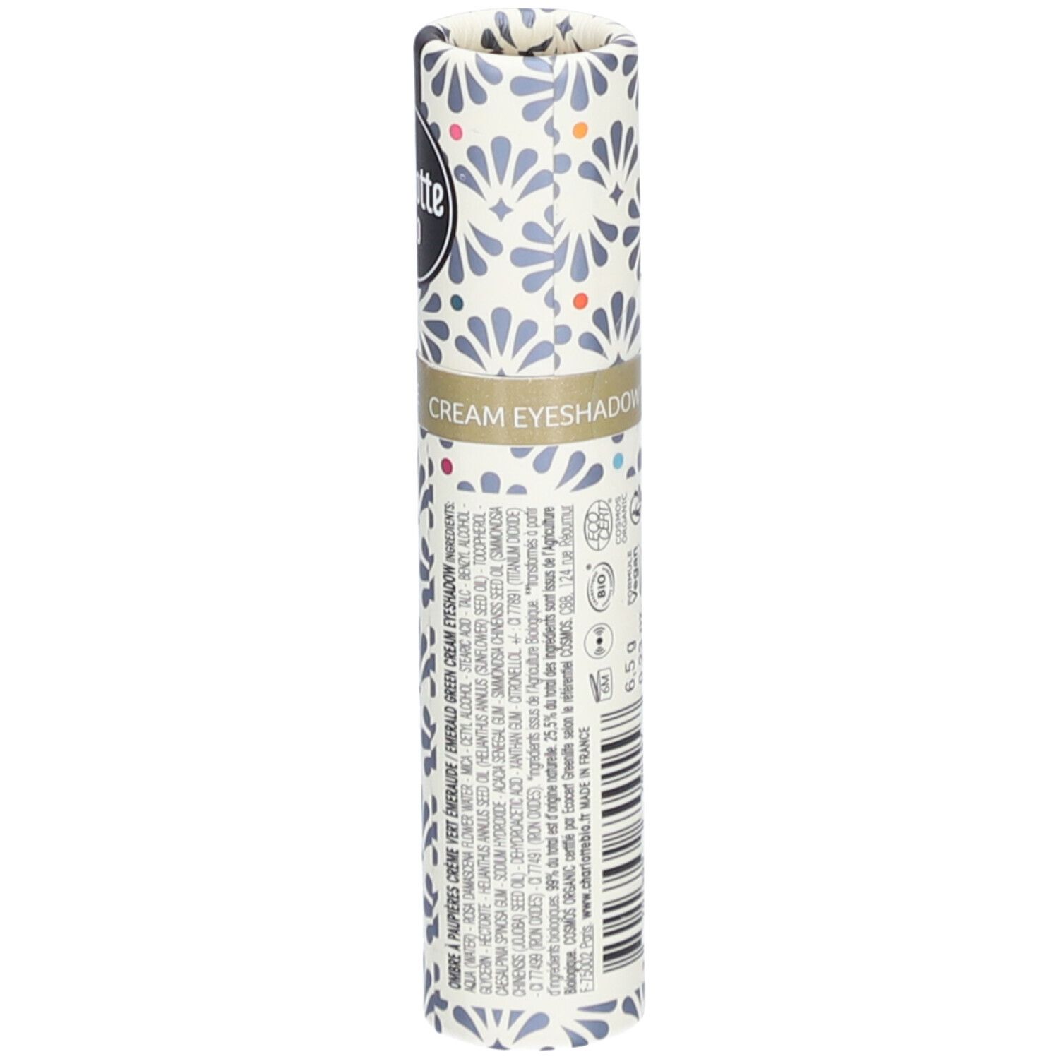 Emballage cylindrique à motifs floraux. Texte: Cream Eyeshadow. Ingrédients, logo vegan. 6,5 g.