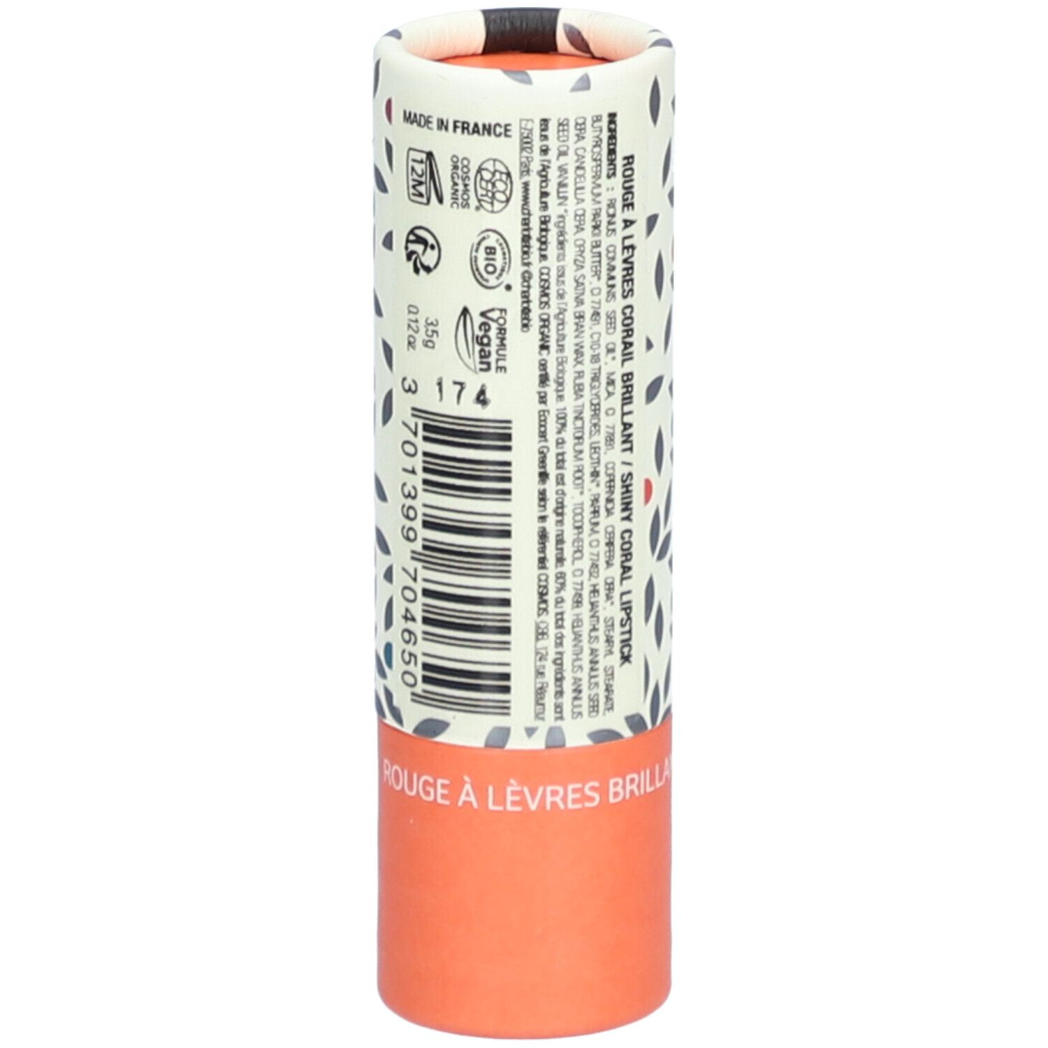 Emballage de rouge à lèvres. Cylindrique, imprimé floral. Texte : Rouge à lèvres brillant, Shiny Coral Lipstick. Code-barres, logo Vegan.