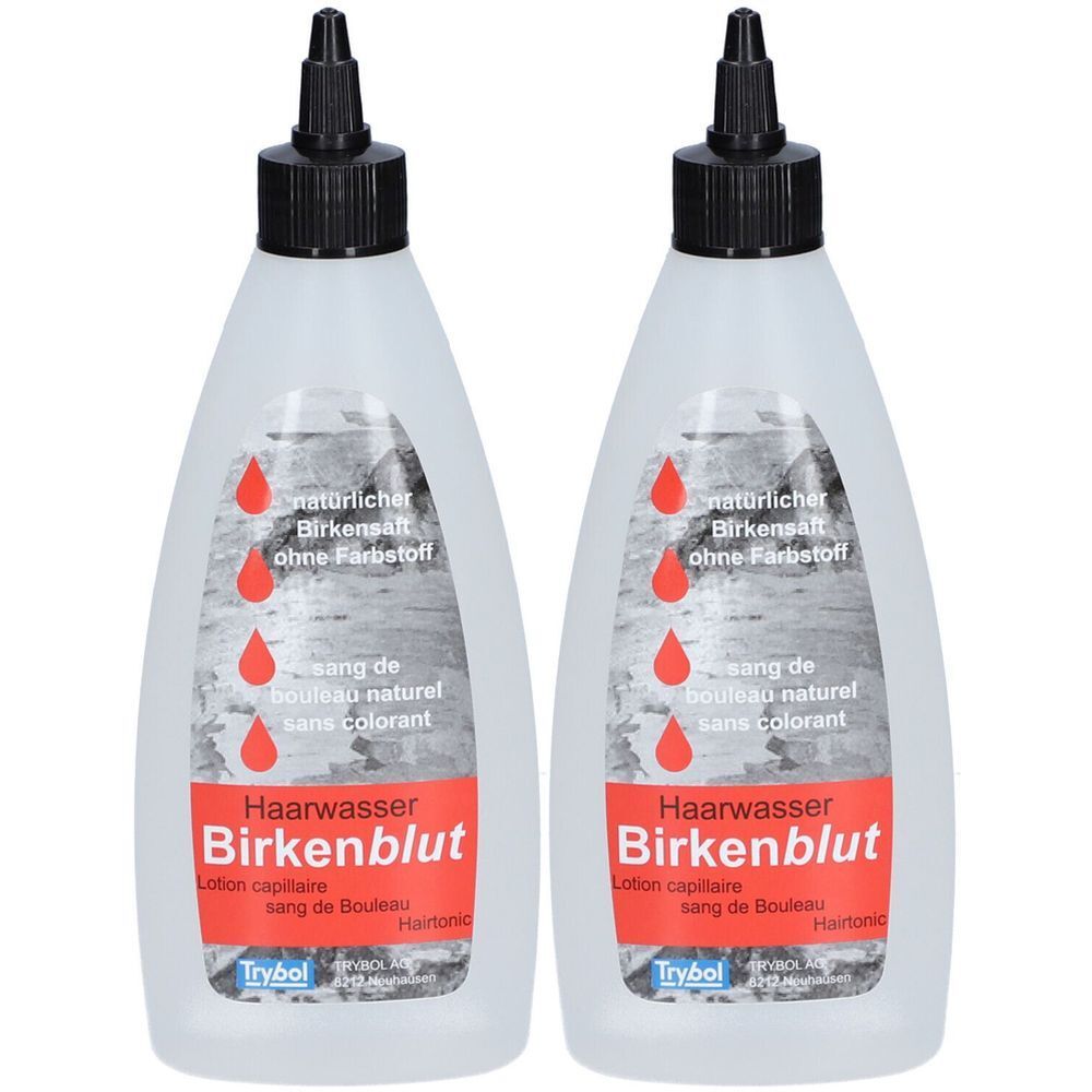 Deux flacons de lotion capillaire Birkenblut. Flacons blancs avec bouchon noir. Inscription rouge et gouttes rouges sur le devant.