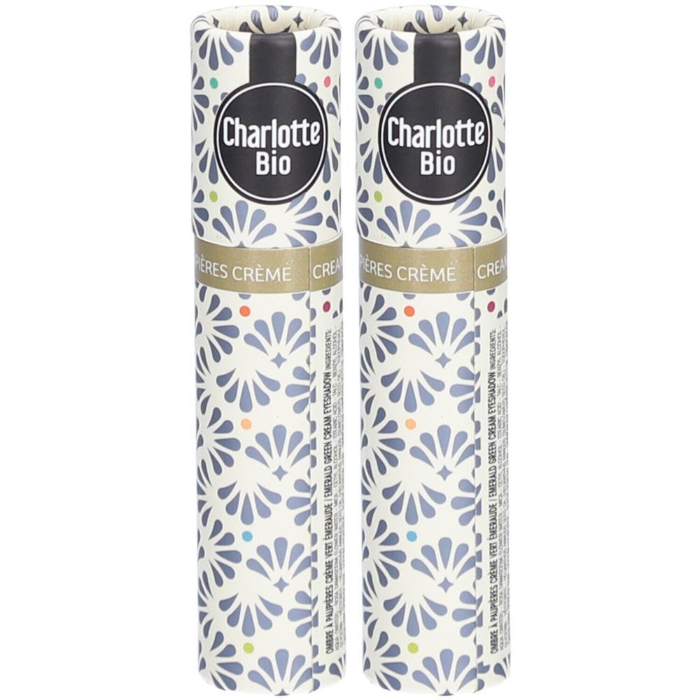 Deux emballages cylindriques. Marque Charlotte Bio. Motifs floraux. Couvercle noir. Texte: Crème, fard à paupières.