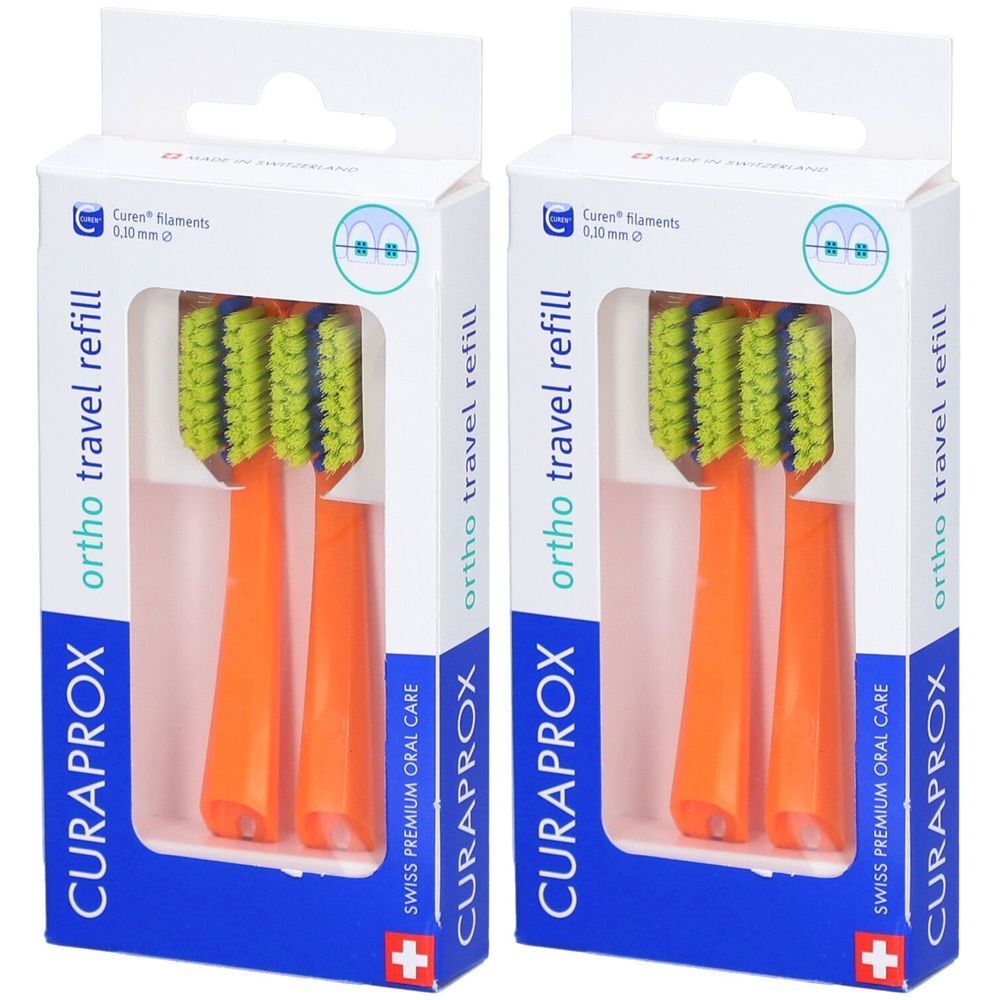 Deux recharges de brosses à dents orange. Soies vert-jaune, manche orange. Emballage avec logo et nom du produit.