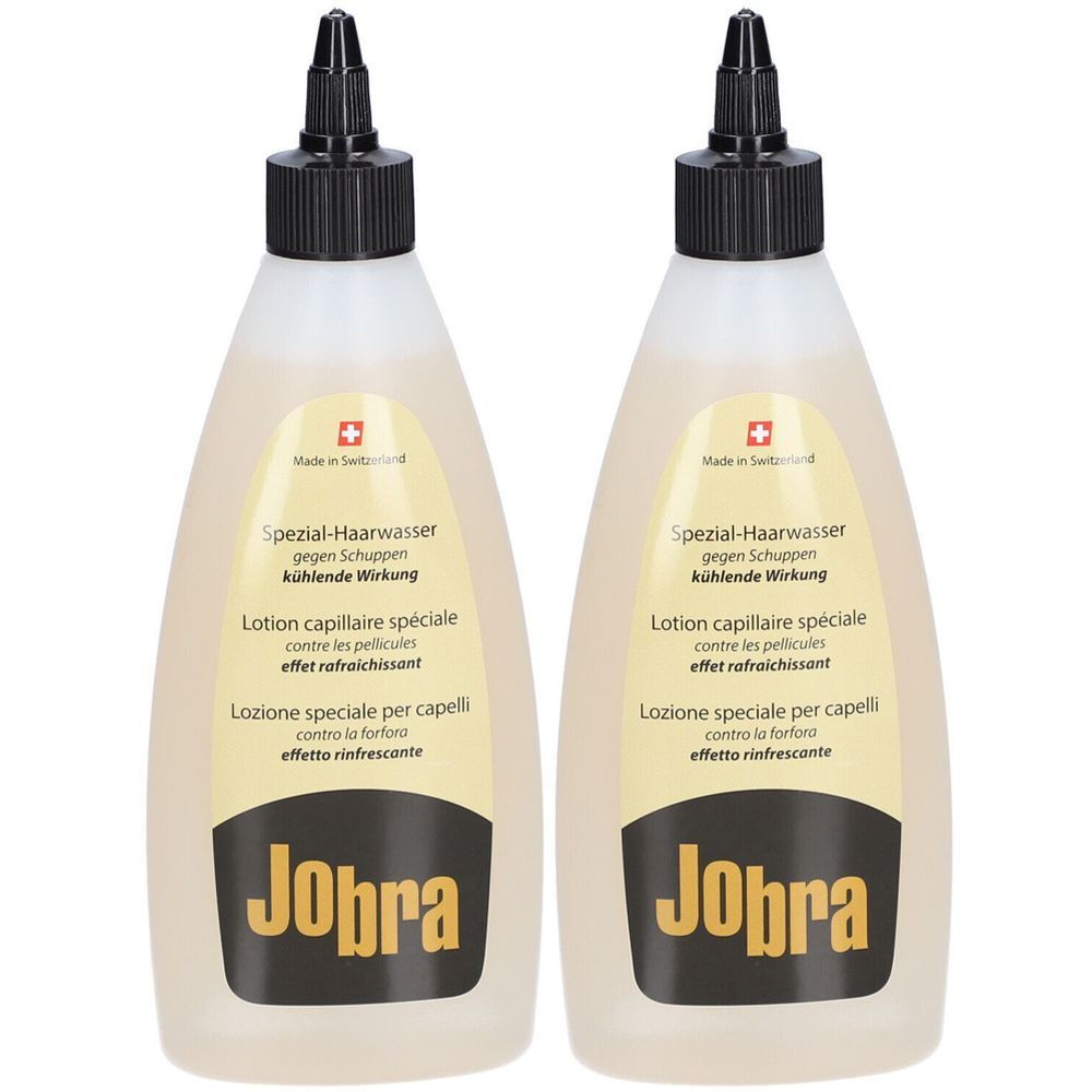 Deux flacons de lotion avec bouchon noir. Inscription: Jobra, Lotion capillaire spéciale contre les pellicules, effet rafraîchissant.
