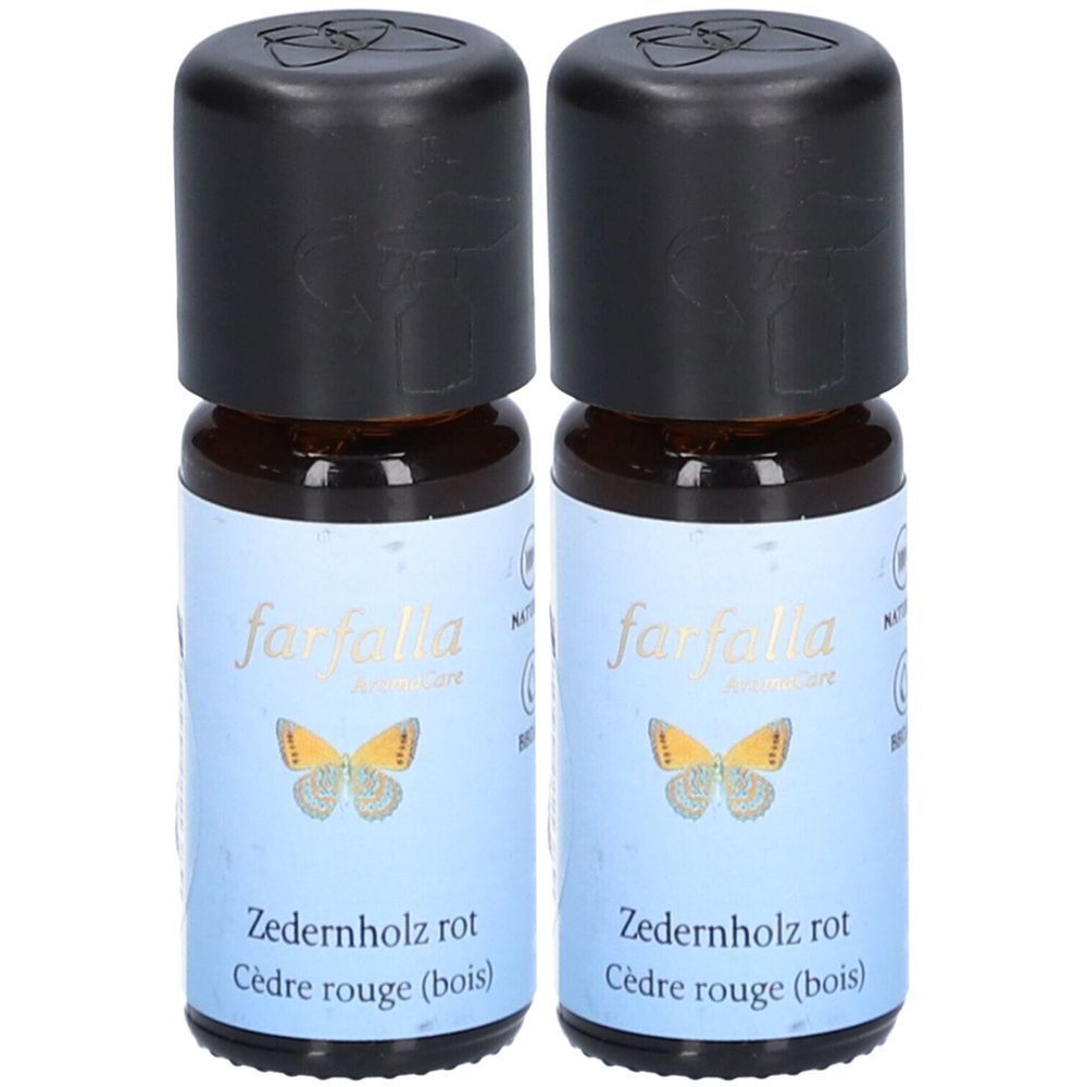 Deux petites bouteilles en verre brun avec des bouchons noirs. Les étiquettes indiquent "farfalla AromaCare" et "Cèdre rouge (bois)".