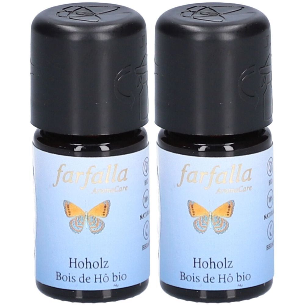 Deux flacons en verre avec bouchons noirs. Étiquette avec "farfalla", un papillon et "Hoholz Bois de Hô bio".