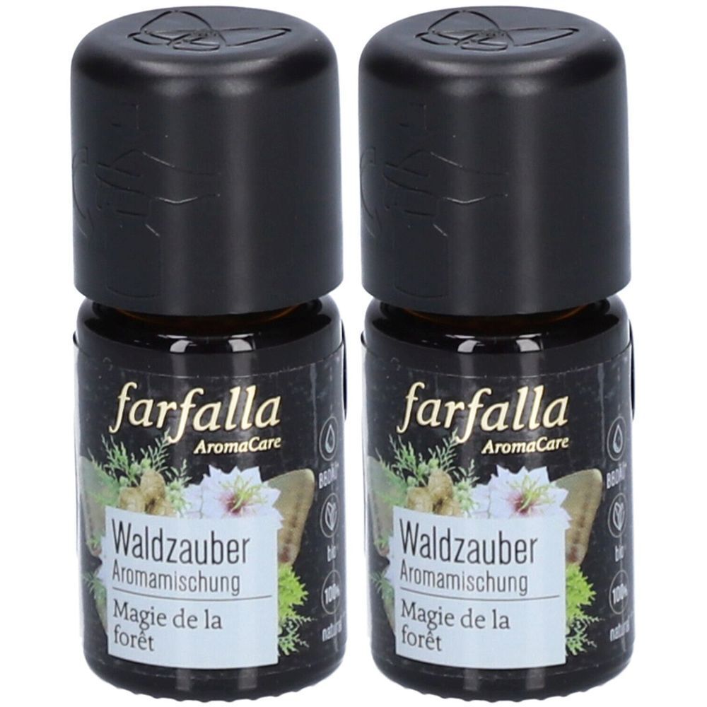 Deux flacons avec bouchons noirs. L'étiquette indique "farfalla AromaCare Waldzauber Aromamischung Magie de la forêt".
