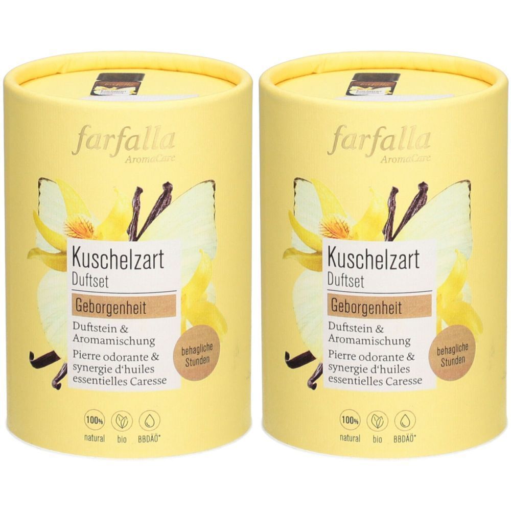 Deux boîtes cylindriques Farfalla AromaCare Set. Inscription : Kuschelzart Duftset Geborgenheit. Design floral et logo.