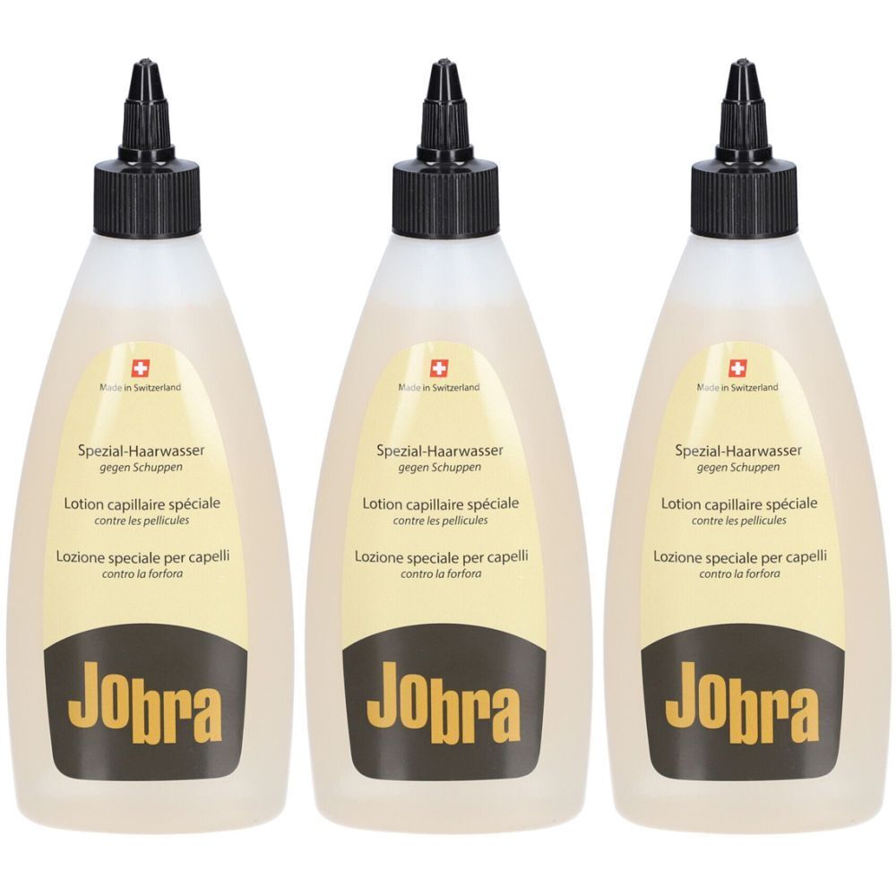 Trois flacons de lotion avec bouchon noir. Inscription : Jobra, Lotion capillaire spéciale contre les pellicules.