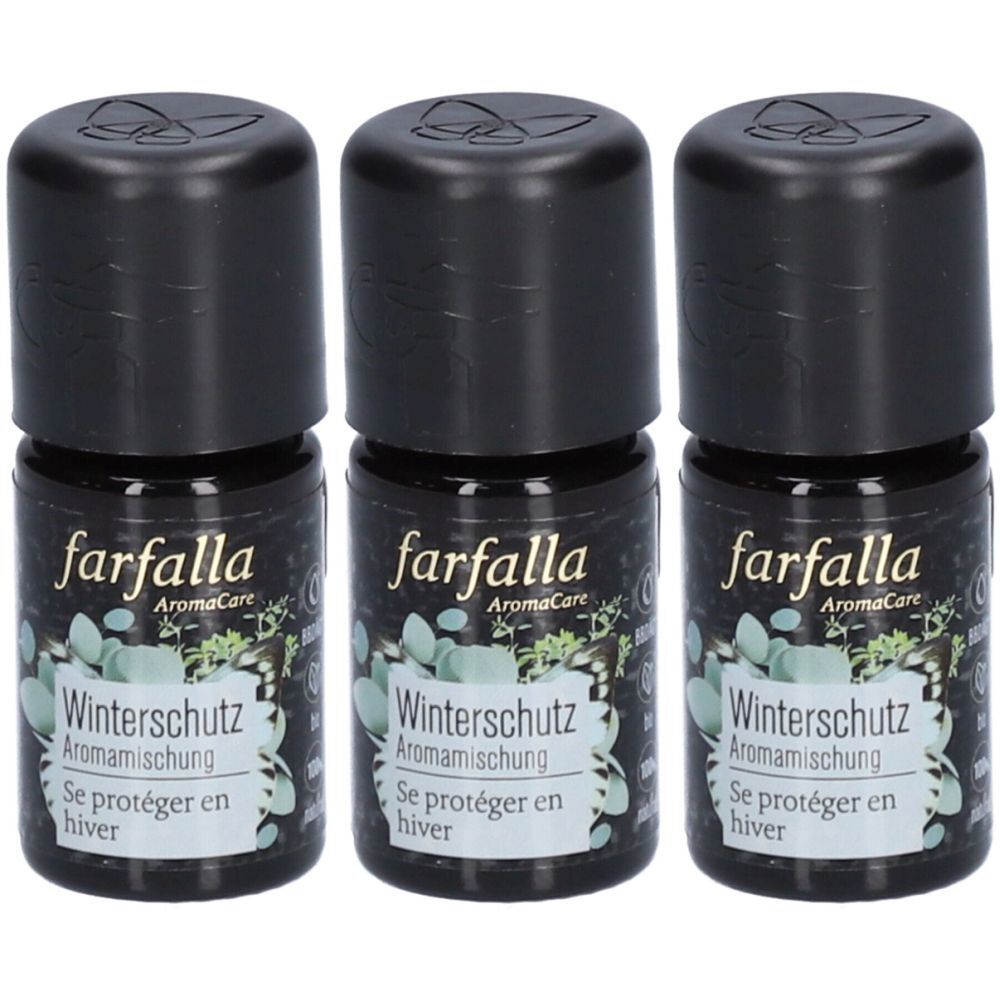 Trois petites bouteilles noires. Les étiquettes indiquent "farfalla AromaCare Winterschutz Aromamischung" et "Se protéger en hiver".