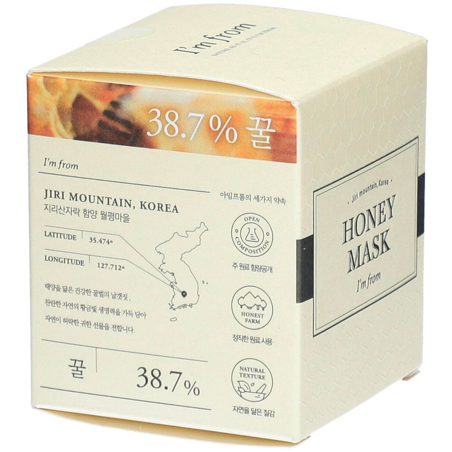 Boîte en carton beige. Inscription: HONEY MASK, I'm from. Texte, carte, 38,7%. Forme carrée.