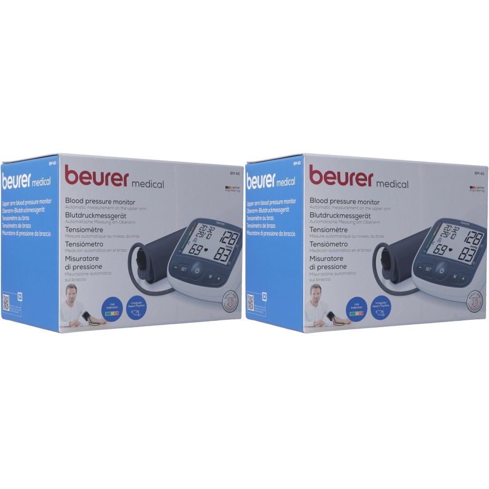 Deux boîtes d'un tensiomètre. Sur l'emballage, on lit "beurer medical" et "Blood pressure monitor". L'appareil affiche des valeurs.