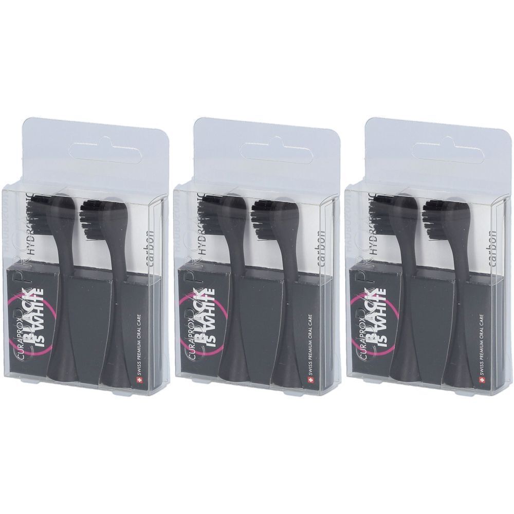 Trois emballages de têtes de brosse à dents noires. Chaque emballage contient deux têtes de brosse et est dans un emballage transparent.
