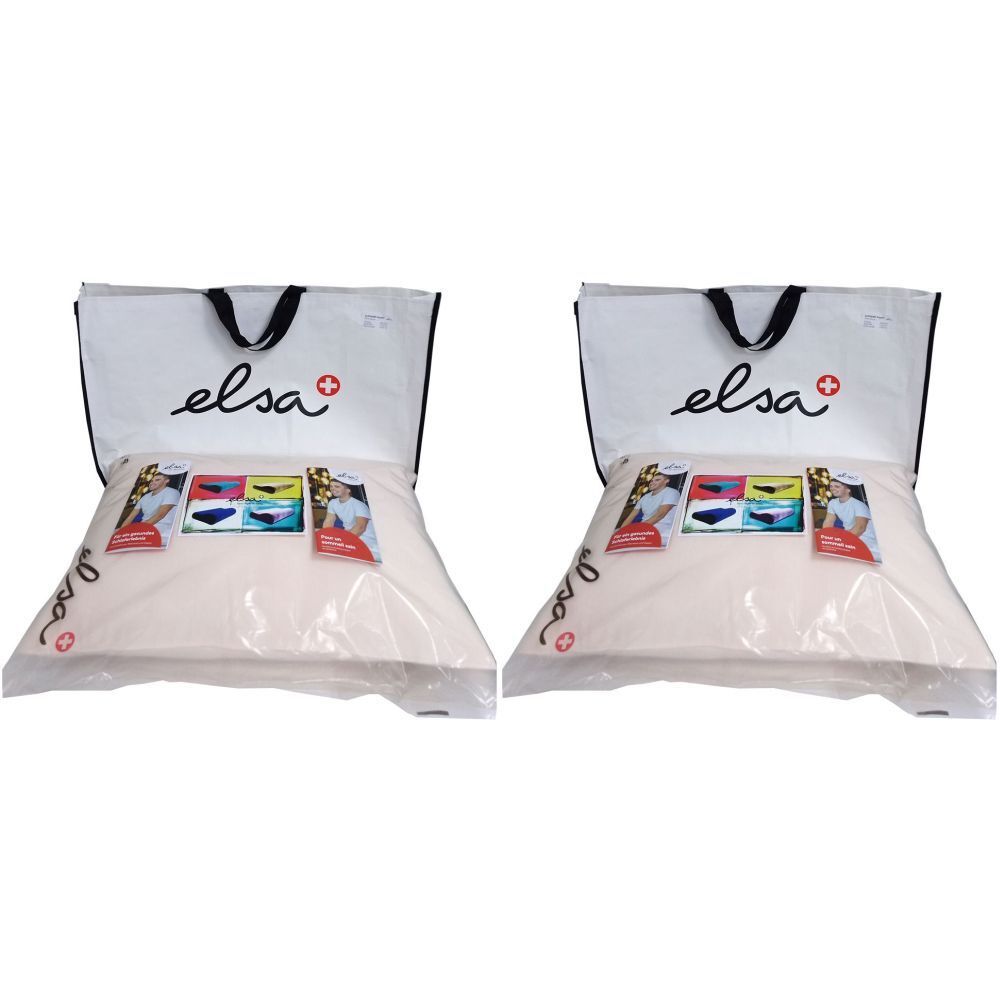 Deux oreillers emballés dans du plastique, dans des sacs blancs avec poignée noire. Le mot "elsa" est écrit sur les sacs.