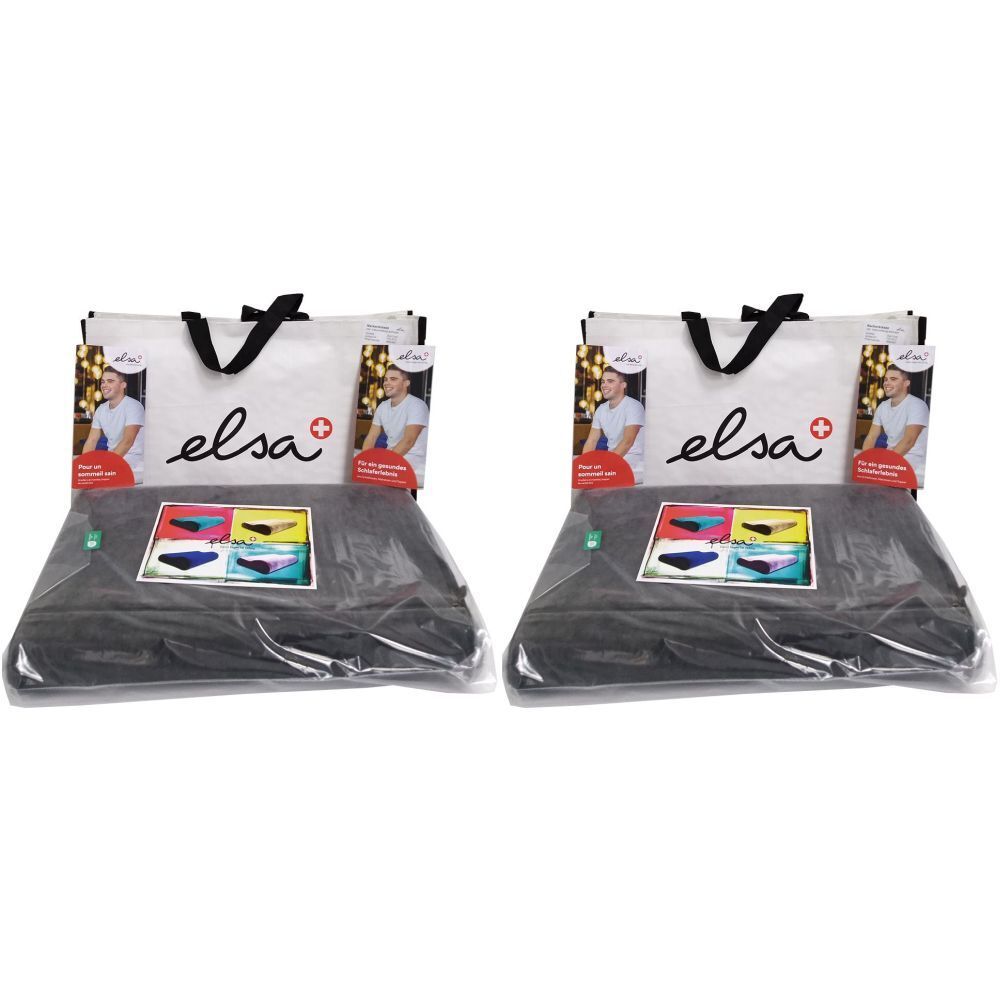 Deux coussins en forme de coin noirs, emballés. Le nom de la marque "elsa" est visible sur l'emballage.