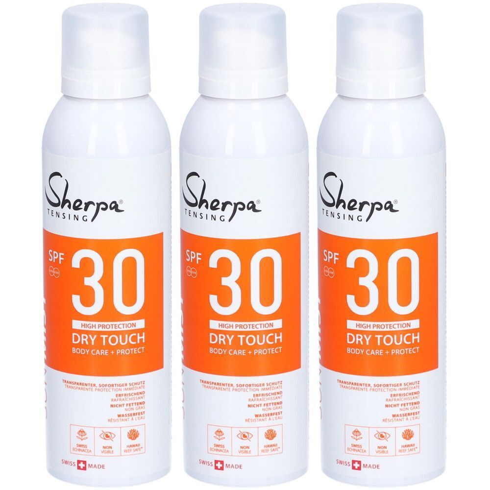 Trois flacons spray blancs avec étiquettes oranges. Inscription : Sherpa, SPF 30, Dry Touch, Body Care + Protect. Croix suisse.
