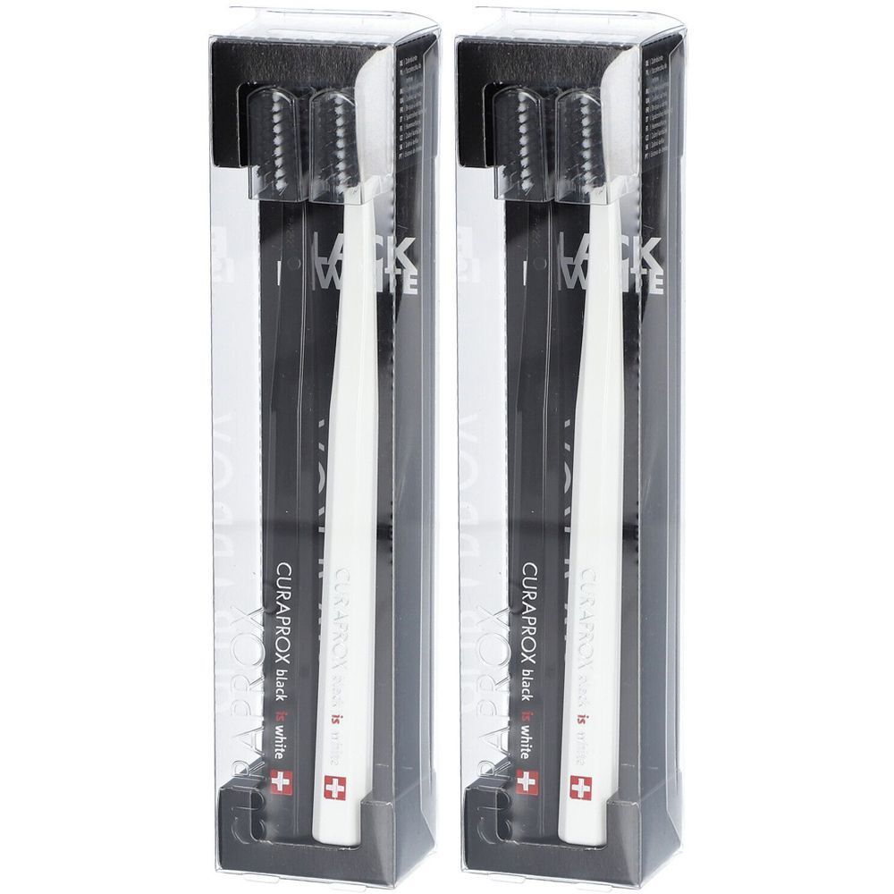 Deux brosses à dents dans des emballages transparents. Soies noires, manche blanc. Croix suisse.