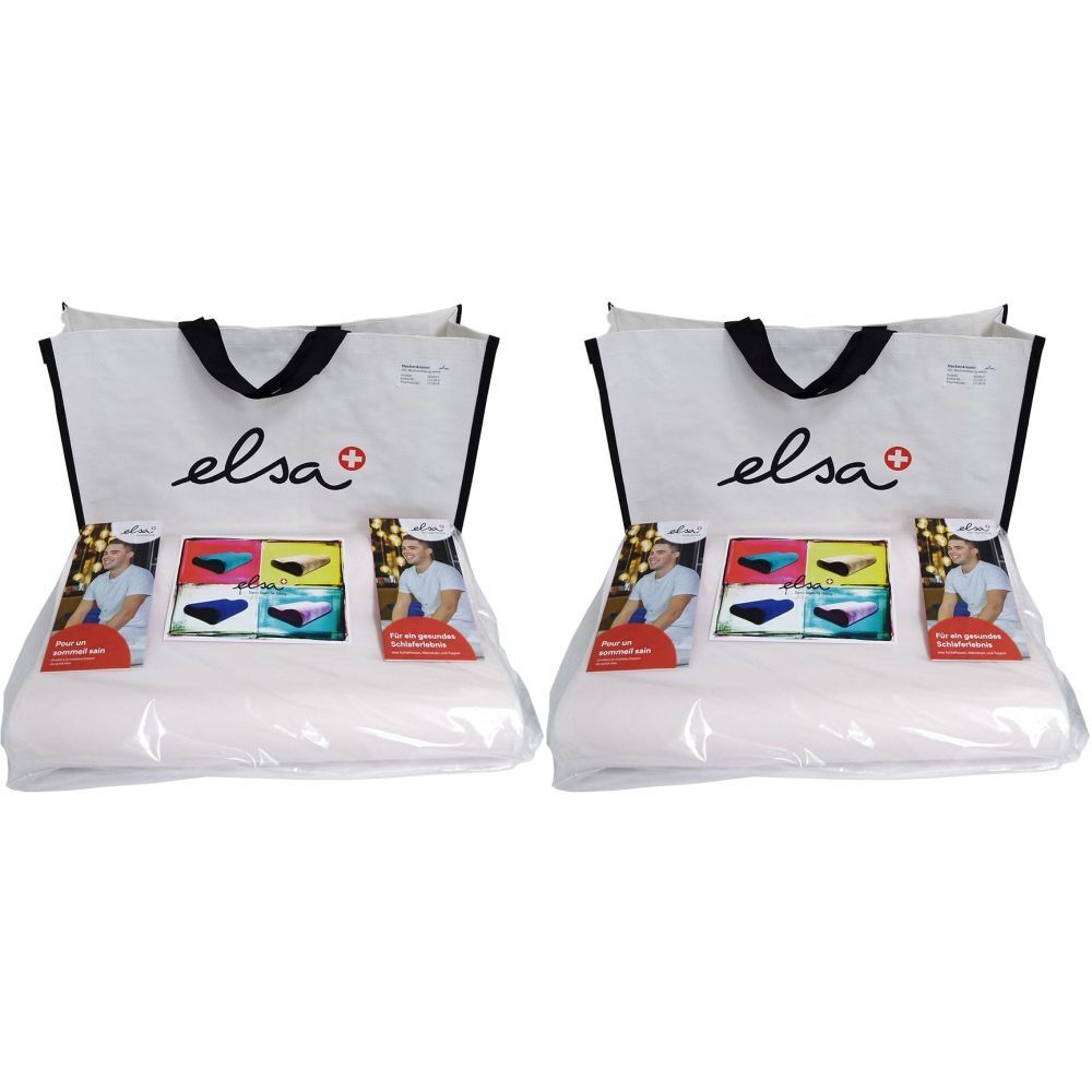 Deux coussins de nuque blancs emballés dans du plastique, avec des sacs. Les sacs portent le nom "elsa" et une croix rouge.