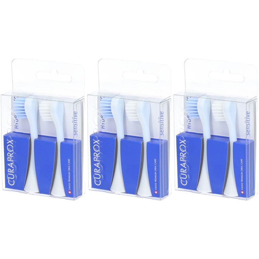 Trois paquets de brosses de rechange. Chaque paquet contient deux têtes bleues et deux têtes blanches. Logo CURAPROX visible.