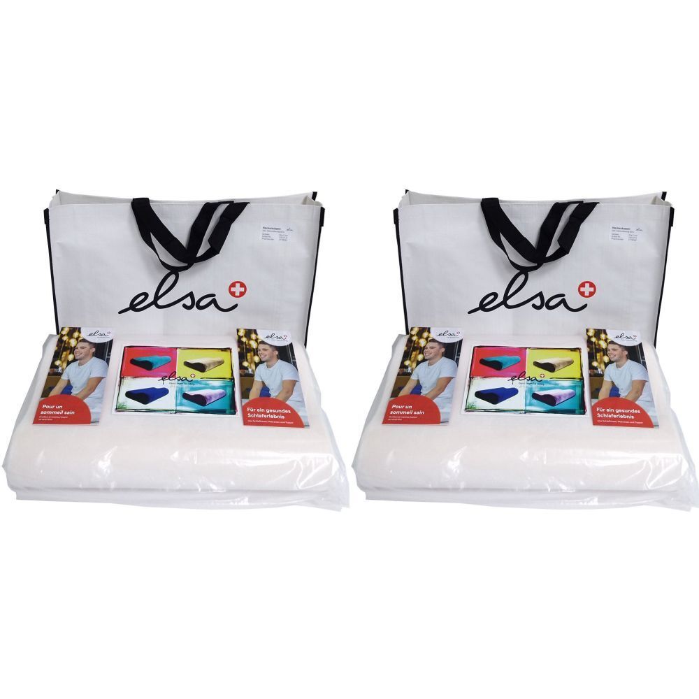 Deux coussins de nuque ELSA emballés dans du plastique, avec matériel promotionnel et sac de transport. "elsa" est écrit sur le sac.