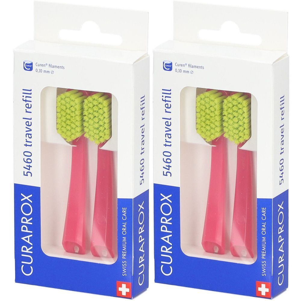 Deux recharges de brosse à dents dans un emballage blanc. Soies vertes, manche rose. Inscription : CURAPROX, 5460 travel refill.