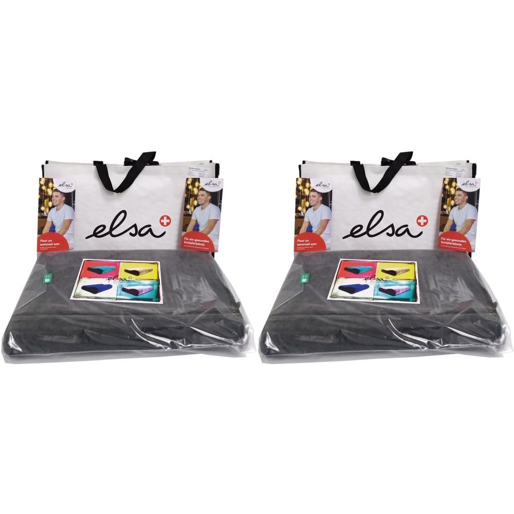 Deux coussins de nuque ELSA emballés. Sac avec logo et homme. Housse de coussin en velours anthracite.