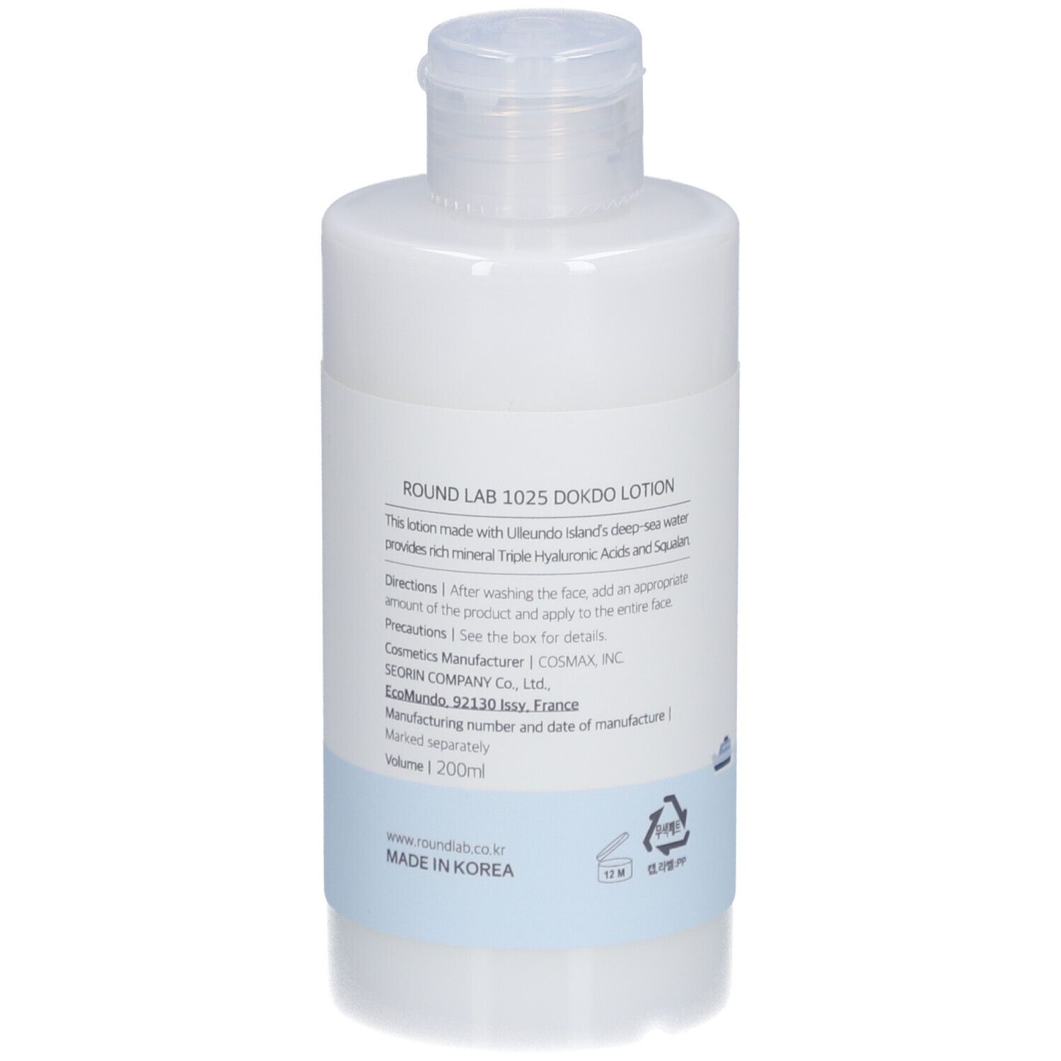 Flacon de lotion blanc avec bouchon rabattable. Texte au dos. Informations sur les ingrédients et le fabricant.