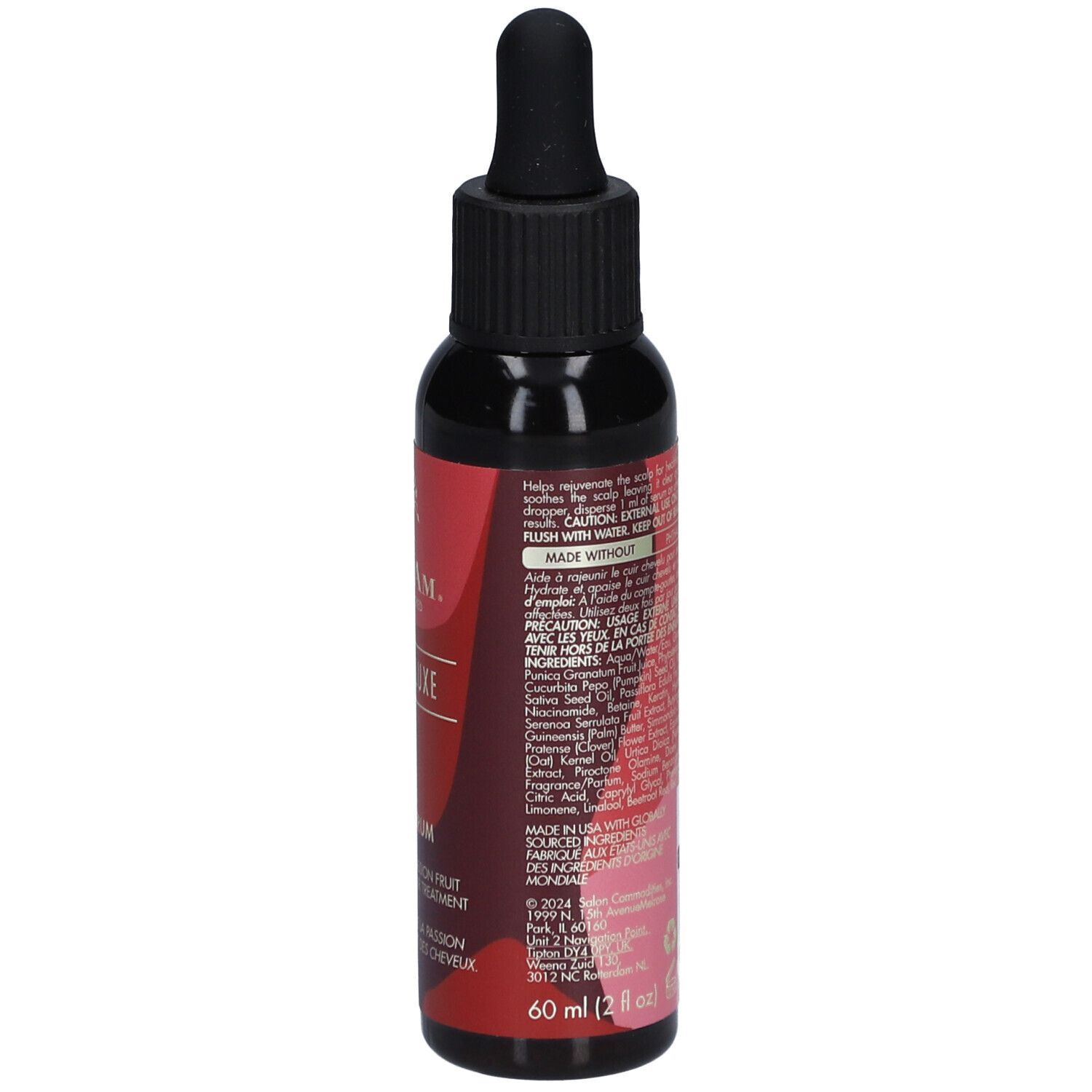 Flacon foncé, vue latérale. Étiquette rouge avec texte et ingrédients. Bouchon noir avec pipette.