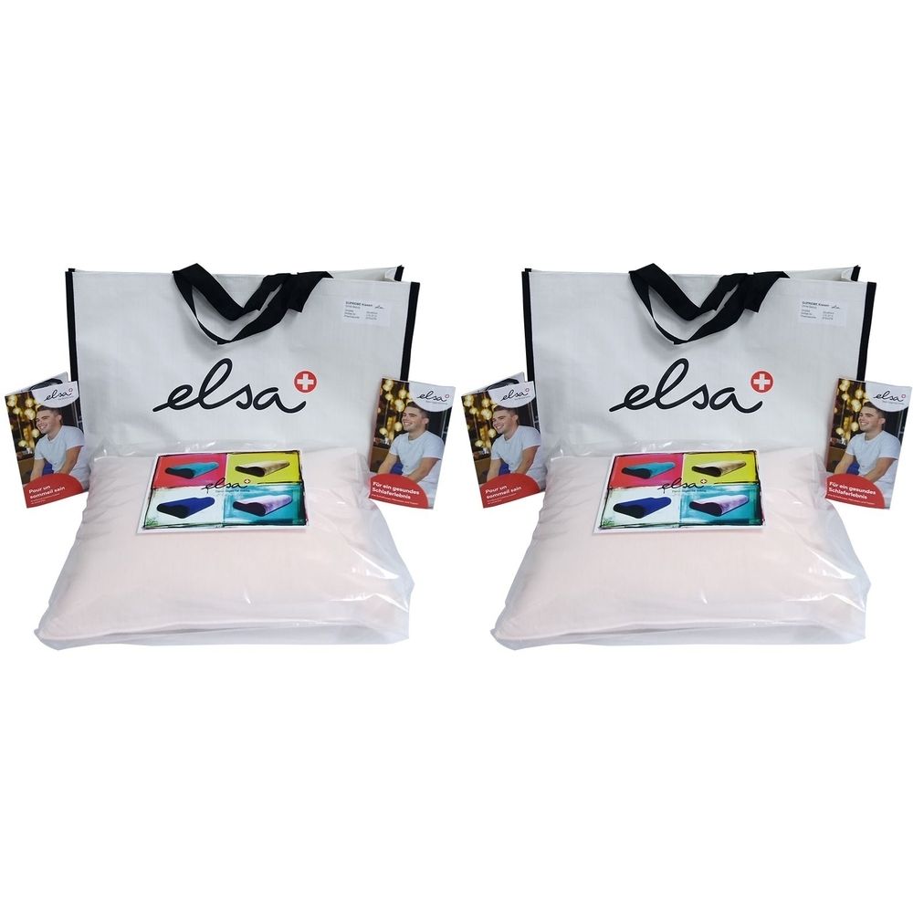 Deux oreillers emballés, avec brochures et sacs. Le logo "elsa" est visible sur les sacs.