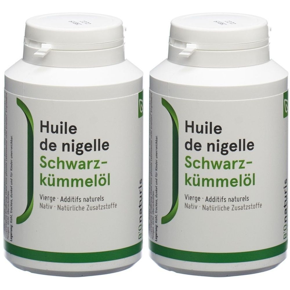 Deux flacons blancs d'huile de nigelle. Inscription : Huile de nigelle, Schwarz-kümmelöl. Avec logo vert.