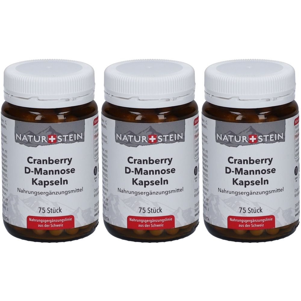 Trois flacons bruns avec des couvercles blancs. Les étiquettes indiquent "NATUR+STEIN Cranberry D-Mannose Kapseln". Chaque flacon contient 75 pièces.