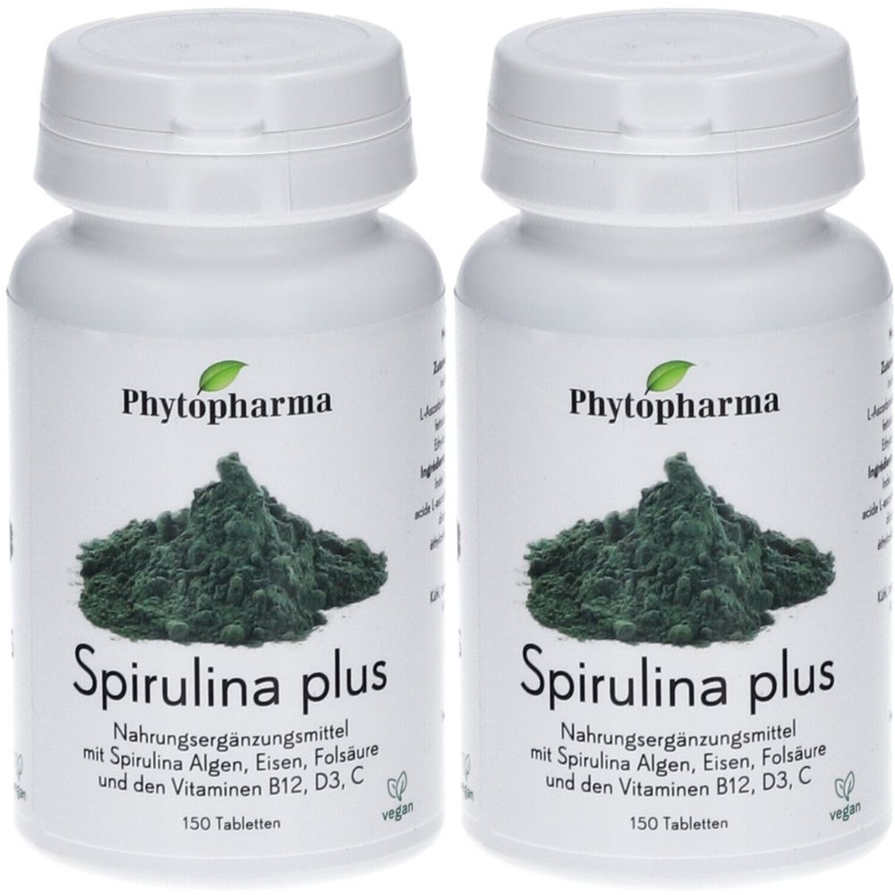 Deux flacons blancs "Phytopharma Spirulina plus". Inscription: Complément alimentaire avec algues spiruline, fer, acide folique et vitamines B12, D3, C. 150 comprimés.